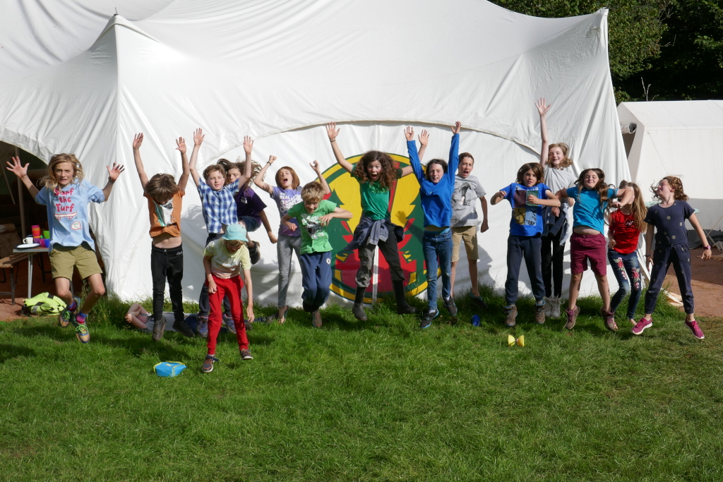 Children jumping outside the marquee